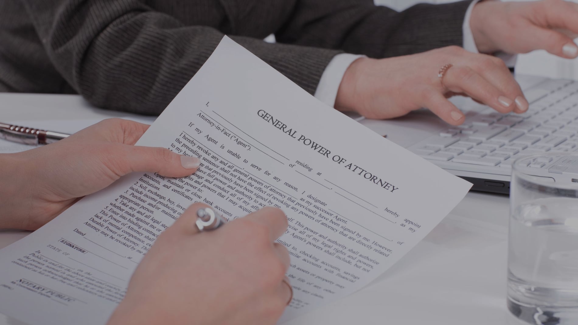 Client reviewing a general power of attorney with the notary