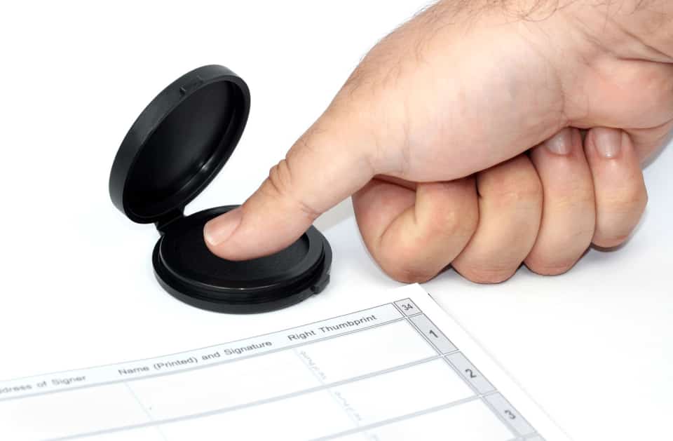 Executives reviewing a corporate agreement before signing